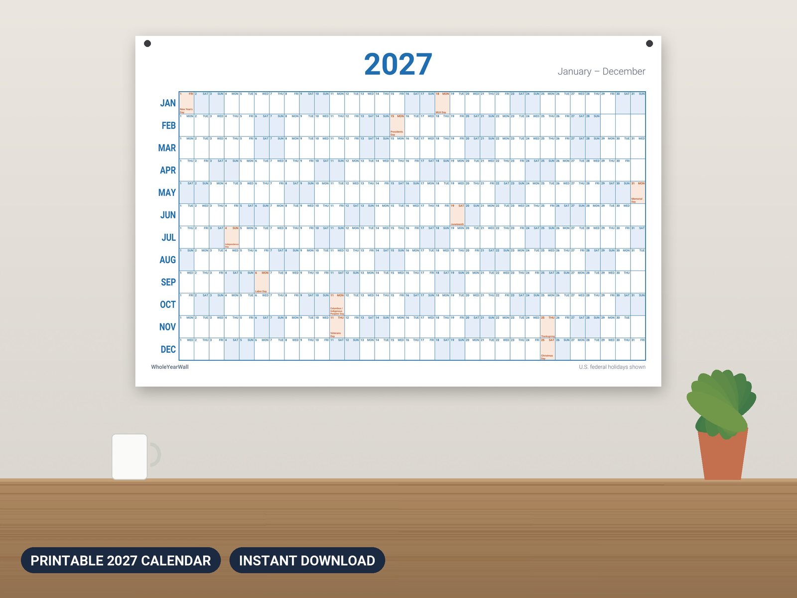 2027 year at a glance wall calendar printed and hung on a wall